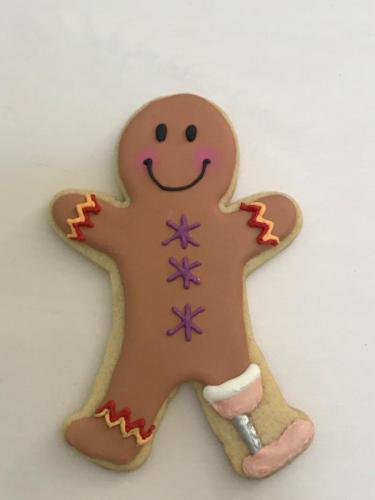 Close up of gingerbread man with prosthetic leg